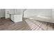 Open-concept space features LVP flooring, a kitchen, and a carpeted living area at 2348 Argento Cir, Dacula, GA 30019