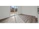 Living room featuring a sliding glass door and LVP flooring at 2348 Argento Cir, Dacula, GA 30019