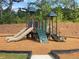 Community playground with slides, climbing structures, and cushioned ground covering for safety at 2348 Argento Cir, Dacula, GA 30019