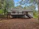 Spacious backyard with a large wooden deck, offering great outdoor living and entertaining space at 3458 Natalie Ct, Loganville, GA 30052
