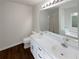 Bright bathroom with double sink vanity, and large mirror at 3458 Natalie Ct, Loganville, GA 30052