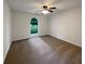 Vacant bedroom with neutral carpet, ceiling fan, and arched window at 3458 Natalie Ct, Loganville, GA 30052