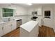 Bright kitchen with white cabinets, stainless steel appliances, and center island at 3458 Natalie Ct, Loganville, GA 30052