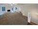 Open concept living room with access to back deck and hardwood floors at 3458 Natalie Ct, Loganville, GA 30052
