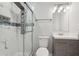Modern bathroom featuring a glass shower, vanity with sink, and a toilet at 1340 Juneau Ct, Tucker, GA 30084