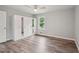 Bedroom with wood-look floors, natural light and a wardrobe at 1340 Juneau Ct, Tucker, GA 30084
