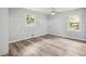Sunlit bedroom with wood-look floors, light gray walls and white trim at 1340 Juneau Ct, Tucker, GA 30084
