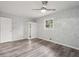 Bright bedroom with wood-look flooring, wardrobe, and a ceiling fan at 1340 Juneau Ct, Tucker, GA 30084