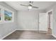 Bright bedroom with modern ceiling fan, light gray walls, and wood-look floors at 1340 Juneau Ct, Tucker, GA 30084