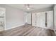 Bedroom with wood-look floors, walk-in closet, and ceiling fan at 1340 Juneau Ct, Tucker, GA 30084