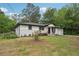Wide angle of the house showing recent upgrades to siding and landscaping at 1340 Juneau Ct, Tucker, GA 30084