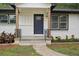 Inviting front entrance with a newly painted door, decorative railings, and colorful flower beds at 1340 Juneau Ct, Tucker, GA 30084
