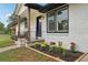 Close-up view of the front porch with decorative iron railings and fresh landscaping at 1340 Juneau Ct, Tucker, GA 30084