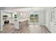 Modern kitchen open to the living area, featuring stainless steel appliances and access to the backyard at 1340 Juneau Ct, Tucker, GA 30084
