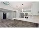 Open concept kitchen with stainless steel appliances, and a stylish island, adjacent to the front entrance at 1340 Juneau Ct, Tucker, GA 30084