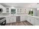 Spacious kitchen with white cabinets, stainless steel appliances and stone countertops at 1340 Juneau Ct, Tucker, GA 30084