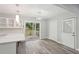 Bright kitchen with stainless steel appliances, a breakfast bar with views of the yard and contemporary pendant lighting at 1340 Juneau Ct, Tucker, GA 30084