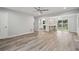 Open concept living room showcasing light-colored flooring and a seamless transition to the kitchen area at 1340 Juneau Ct, Tucker, GA 30084