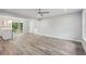 Spacious living room with a view of the kitchen, access to the yard, and modern lighting at 1340 Juneau Ct, Tucker, GA 30084