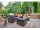 Cozy backyard with outdoor seating and a beautiful plant at 1678 Capistrana Pl, Decatur, GA 30032