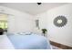 This bedroom boasts a queen bed, brick wall, backyard access, and modern decor at 1678 Capistrana Pl, Decatur, GA 30032