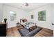 Modern bedroom features hardwood floors, lots of natural light, and neutral decor at 1678 Capistrana Pl, Decatur, GA 30032