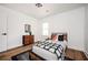 Bedroom with wood floors, modern fixtures, and neutral paint colors at 1678 Capistrana Pl, Decatur, GA 30032