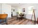 Dining area seamlessly flows into the living space with sleek hardwood floors and natural light at 1678 Capistrana Pl, Decatur, GA 30032