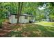 Lovely single-story home with a freshly painted exterior, new stairs, and mature trees at 1678 Capistrana Pl, Decatur, GA 30032
