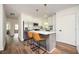 Modern kitchen featuring white cabinets, stainless steel appliances, and a breakfast bar at 1678 Capistrana Pl, Decatur, GA 30032