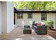 Inviting outdoor patio area with stylish seating and a charming rug, perfect for relaxing and entertaining at 1678 Capistrana Pl, Decatur, GA 30032