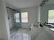 Bathroom featuring a glass enclosed shower, modern sink, and vanity at 3050 Camden Way, Alpharetta, GA 30005
