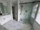 Beautiful bathroom featuring a glass shower, marble floors, and a double sink vanity at 3050 Camden Way, Alpharetta, GA 30005