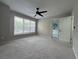 Inviting bedroom with carpet, ceiling fan, and natural light with attached bath at 3050 Camden Way, Alpharetta, GA 30005