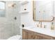 Modern bathroom with glass shower, white subway tiles, light wood vanity, and gold hardware at 35 Sheridan Ne Dr # 7, Atlanta, GA 30305