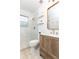 Modern bathroom with glass enclosed shower, wooden vanity, gold fixtures, and stylish tile flooring at 35 Sheridan Ne Dr # 7, Atlanta, GA 30305