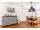 Vintage cabinet and dining area with modern pendant light at 35 Sheridan Ne Dr # 7, Atlanta, GA 30305