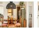 Dining room featuring a round table, four chairs, unique light fixture, and hardwood floors at 35 Sheridan Ne Dr # 7, Atlanta, GA 30305