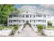 Charming white-painted three-story building with symmetrical window and shutter design at 35 Sheridan Ne Dr # 7, Atlanta, GA 30305