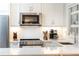Bright, updated kitchen with white cabinets, stainless steel appliances, and subway tile backsplash at 35 Sheridan Ne Dr # 7, Atlanta, GA 30305