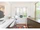 Home office featuring a modern desk, ample natural light, and colorful rug at 35 Sheridan Ne Dr # 7, Atlanta, GA 30305
