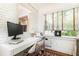 Office featuring a modern desk, natural light, and a colorful rug at 35 Sheridan Ne Dr # 7, Atlanta, GA 30305