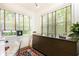 A home office featuring a modern desk, natural light, and a colorful rug at 35 Sheridan Ne Dr # 7, Atlanta, GA 30305