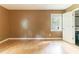 Bedroom with hardwood floors, window, and open door to closet at 4507 Laurie Ln, Powder Springs, GA 30127