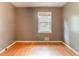 Empty bedroom with hardwood floors and a window at 4507 Laurie Ln, Powder Springs, GA 30127