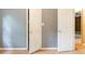 Bedroom with an open closet door and hardwood floors at 4507 Laurie Ln, Powder Springs, GA 30127
