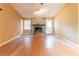 Spacious living room with stone fireplace, hardwood floors and lots of natural light from door and window at 4507 Laurie Ln, Powder Springs, GA 30127