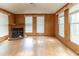 Spacious living room with hardwood floors, a fireplace, and lots of natural light from the many windows at 4507 Laurie Ln, Powder Springs, GA 30127