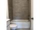 Bathroom featuring a shower and gray tile at 1616 Avery Way, Tucker, GA 30084