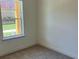 Bedroom features a carpeted floor and a window at 1616 Avery Way, Tucker, GA 30084
